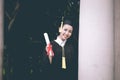 Attractive Beautiful Asian Graduated woman in cap and gown smile