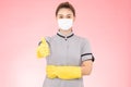 Attractive Beautiful Asian woman maid wearing face mask and gloves smile and thumbs up sign feeling so happiness and confident,Iso