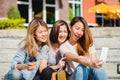 Attractive beautiful asian woman using a smartphone while shopping in the city. Happy young asian teenage at urban city. Royalty Free Stock Photo