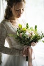 Attractive Beautiful Bride Holding Flowers Bouquet Royalty Free Stock Photo