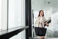 Attractive and beautiful businesswoman standing in office Royalty Free Stock Photo