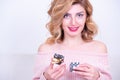 Attractive beautiful model woman holds small gift box