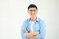 Attractive beautiful smiling positive nerd man. Close up portrait asian man wearing glasses isolated on white background