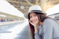 Attractive beautiful woman is waiting train for traveling around the city.