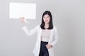 Asian woman holding  empty speech bubble Royalty Free Stock Photo