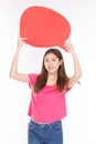 Attractive beautiful young asian woman smile and excited holding empty speech bubble on white background Royalty Free Stock Photo