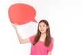 Attractive beautiful young asian woman smile and excited holding empty speech bubble on white background Royalty Free Stock Photo