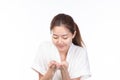 Attractive beauty young Asian woman washing her face with foam cleanser in the morning on white background Royalty Free Stock Photo