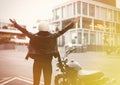 Attractive biker girl posing close to her bike. Royalty Free Stock Photo