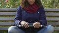 Attractive biracial woman shutting laptop after listening to music, relaxation