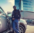 Casual african american man posing near the car. Royalty Free Stock Photo