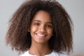 Attractive black teenager girl smiling looking at camera