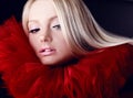 Attractive blond beauty in red theatrical jabot