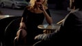 Attractive blond female seducing man on restaurant terrace, escort service Royalty Free Stock Photo