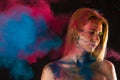 Attractive blond girl in colors paints