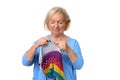 Attractive blond senior lady doing her knitting