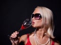 Attractive blond woman drinking her cocktail Royalty Free Stock Photo