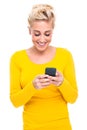 Attractive Blond Woman Texting on Cell Phone Royalty Free Stock Photo