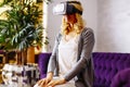 Woman wearing virtual reality goggles in the room Royalty Free Stock Photo