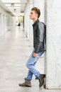 Attractive blond young man standing outside