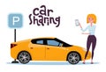 Attractive blond young woman holding mobile phone rents a car in the parking lot online. New yellow car stands at the parking sign