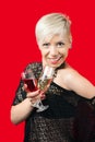 Attractive blonde girl holding glasses of red and white wine Royalty Free Stock Photo