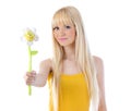 Attractive blonde holding out daisy Royalty Free Stock Photo