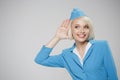 Attractive blonde stewardess overhear on empty space.