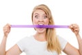 Attractive blonde woman biting tape on mouth. Royalty Free Stock Photo