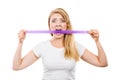 Attractive blonde woman biting tape on mouth. Royalty Free Stock Photo
