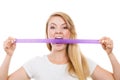 Attractive blonde woman biting tape on mouth. Royalty Free Stock Photo