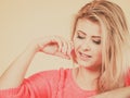 Attractive blonde woman looking down and thinking Royalty Free Stock Photo