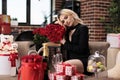 Attractive blonde woman posing with valentines day red roses Royalty Free Stock Photo