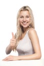 Attractive blonde woman showing thumbsup Royalty Free Stock Photo