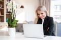 Attractive blonde woman working at home Royalty Free Stock Photo