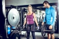 Trap bar deadlift woman with personal trainer