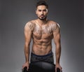 Attractive bodybuilder showing bare torso