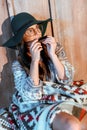 hippie girl playing harmonica Royalty Free Stock Photo