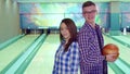 Boy and girl look at each other at the bowling Royalty Free Stock Photo