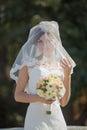 Attractive bride with bridal bouquet Royalty Free Stock Photo