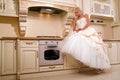Attractive bride sitting in the kitchen