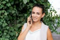 Attractive brunette businesswoman talking on mobile phone. Caucasian business Royalty Free Stock Photo