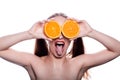 Attractive brunette funny fashion model girl holding orange slice near her eyes