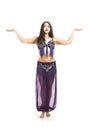 Attractive brunette girl with long hair dancing belly dance. Royalty Free Stock Photo