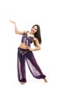 Attractive brunette girl with long hair dancing belly dance. Royalty Free Stock Photo