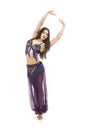 Attractive brunette girl with long hair dancing belly dance. Royalty Free Stock Photo