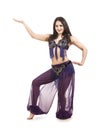 Attractive brunette girl with long hair dancing belly dance. Royalty Free Stock Photo