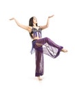 Attractive brunette girl with long hair dancing belly dance. Royalty Free Stock Photo