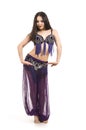 Attractive brunette girl with long hair dancing belly dance. Royalty Free Stock Photo