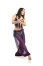 Attractive brunette girl with long hair dancing belly dance. Royalty Free Stock Photo
